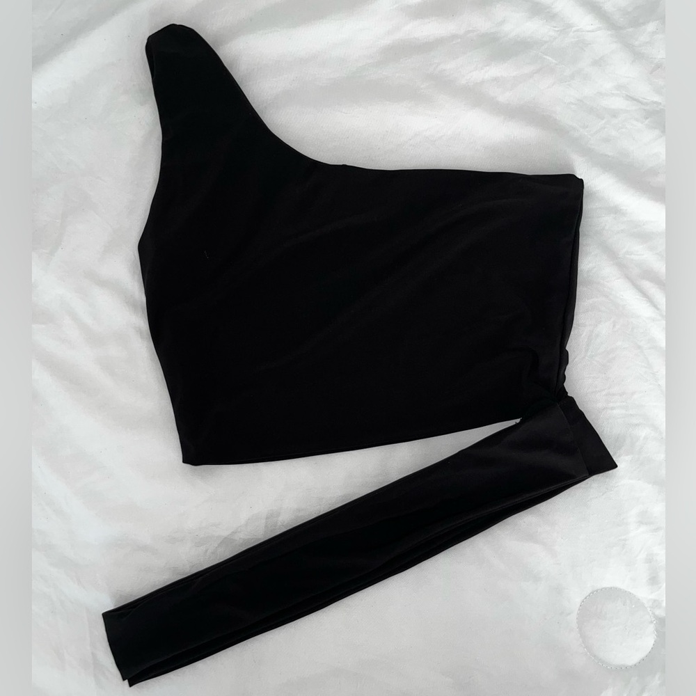 Black one shoulder crop top with the option to tie around waist